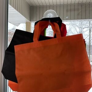 Set of Reusable Tote Bags in Orange, Black, and Red